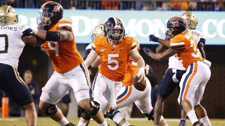 Oct 23, 2021; Charlottesville, Virginia, USA; Virginia Cavaliers quarterback Brennan Armstrong (5) runs with the ball against the Georgia Tech Yellow Jackets during the third quarter at Scott Stadium. Mandatory Credit: Amber Searls-USA TODAY Sports
