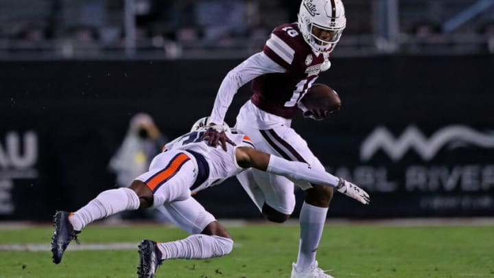 STARKVILLE, MISSISSIPPI - NOVEMBER 05: Jaylin Simpson #36 of the Auburn Tigers attempts to tackle Justin Robinson #18 of the Mississippi State Bulldogs during the first half at Davis Wade Stadium on November 05, 2022 in Starkville, Mississippi. (Photo by Justin Ford/Getty Images)