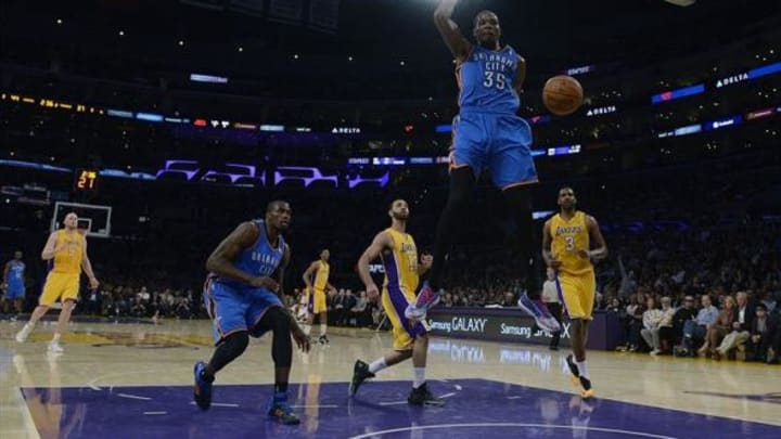 Feb 13, 2014; Los Angeles, CA, USA; Oklahoma City Thunder forward Kevin Durant (35) goes up for a dunk against the Los Angeles Lakers during the second quarter at the Staples Center. Mandatory Credit: Kelvin Kuo-USA TODAY Sports