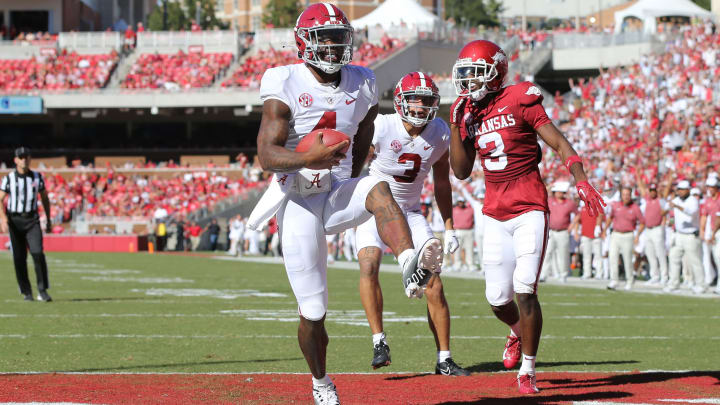 Oct 1, 2022; Fayetteville, Arkansas, USA; Alabama Crimson Tide quarterback Jalen Milroe (4) rushes for a touchdown in the second quarter against the Arkansas Razorbacks at Donald W. Reynolds Razorback Stadium. Mandatory Credit: Nelson Chenault-USA TODAY Sports