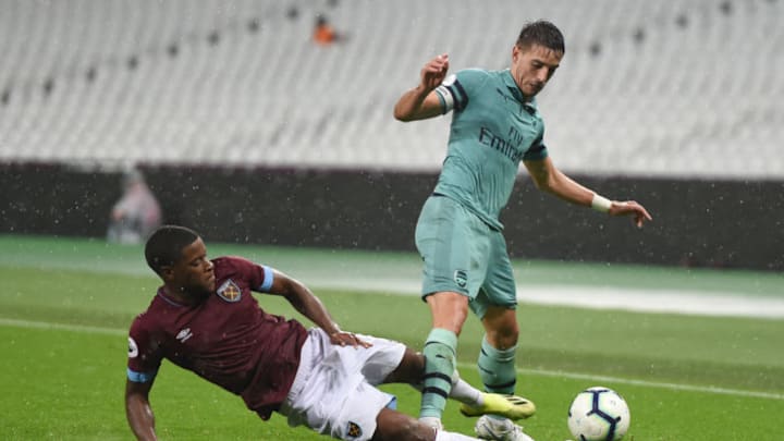 LONDON, ENGLAND - AUGUST 24: Xande Silva of West Ham United fouls Julio Pleguezuelo of Arsenal during the Premier League 2 game between West Ham United and Arsenal at London Stadium on August 24, 2018 in London, England. (Photo by Harriet Lander/Getty Images)