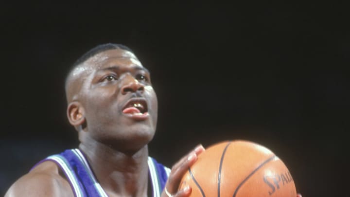 LANDOVER, MD – CIRCA 1995: Larry Johnson #2 of the Charlotte Hornets shoots a free throw against the Washington Bullets during an NBA basketball game circa 1995 at the US Airways Arena in Landover, Maryland. Johnson played for the Hornets from 1991-96. (Photo by Focus on Sport/Getty Images)