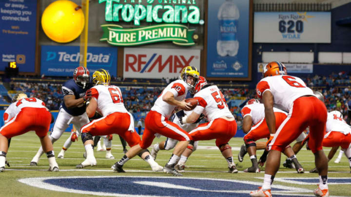 ST. PETERSBURG, FL - JANUARY 23: Jake Rudock #10 from Michigan playing on the East Team takes the snap against the West Team during the first half of the East West Shrine Game at Tropicana Field on January 23, 2016 in St. Petersburg, Florida. (Photo by Mike Carlson/Getty Images)