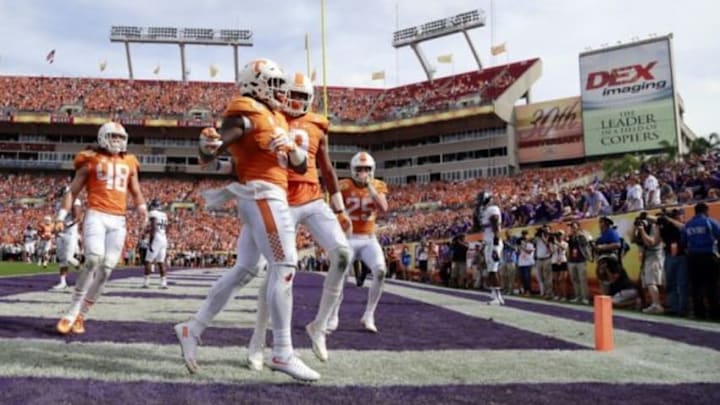 Jan 1, 2016; Tampa, FL, USA; Tennessee Volunteers running back Alvin Kamara (6) is congratulated by teammates as he scores a touchdown against the Northwestern Wildcats during the first half in the 2016 Outback Bowl at Raymond James Stadium. Mandatory Credit: Kim Klement-USA TODAY Sports