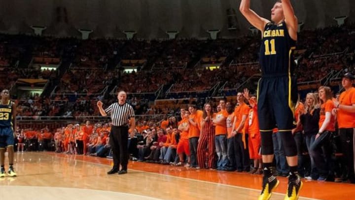Mar 4, 2014; Champaign, IL, USA; Michigan Wolverines guard Nik Stauskas (11) makes one of his seven three pointers against the Illinois Fighting Illini during the second half at State Farm Center. Michigan defeated Illinois 84-53. Mandatory Credit: Bradley Leeb-USA TODAY Sports