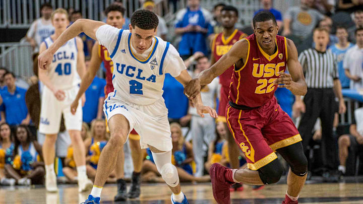 Mar 9, 2017; Las Vegas, NV, USA; UCLA Bruins guard Lonzo Ball (2) and USC Trojans guard De’Anthony Melton (22) compete for the ball during the second half during the Pac-12 Conference Tournament at T-Mobile Arena. UCLA won 76-74. Mandatory Credit: Joshua Dahl-USA TODAY Sports