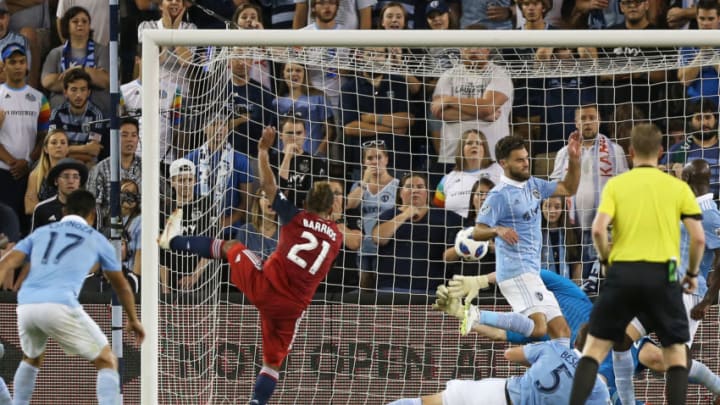KANSAS CITY, KS - JULY 28: FC Dallas midfielder Michael Barrios (21) gets the shot past multiple defenders and Sporting Kansas City goalkeeper Tim Melia (29) for a hat trick in the second half of an MLS match between FC Dallas and Sporting Kansas City on July 28, 2018 at Children's Mercy Park in Kansas City, KS. FC Dallas was 3-2. (Photo by Scott Winters/Icon Sportswire via Getty Images)
