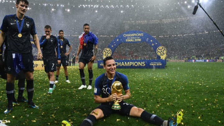 France's forward Florian Thauvin holds the World Cup trophy (FRANCK FIFE/AFP via Getty Images)