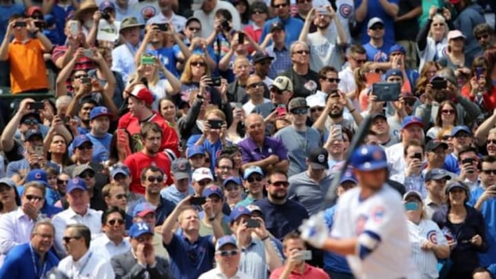 Apr 17, 2015; Chicago, IL, USA; Fans take photos with their cell phones and cameras as Chicago Cubs infielder Kris Bryant comes up to bat during the first inning against the San Diego Padres at Wrigley Field. Mandatory Credit: Jerry Lai-USA TODAY Sports