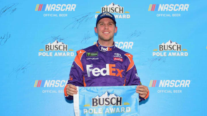 WATKINS GLEN, NY - AUGUST 04: Denny Hamlin, driver of the #11 FedEx Ground Toyota, poses for a photo after winning the Pole Award during qualifying for the Monster Energy NASCAR Cup Series GoBowling at The Glen at Watkins Glen International on August 4, 2018 in Watkins Glen, New York. (Photo by Jared C. Tilton/Getty Images)