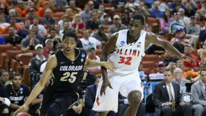 Mar 22, 2013; Austin, TX, USA; Colorado Buffaloes guard Spencer Dinwiddie (25) drives to the goal against Illinois Fighting Illini forward/center Nnanna Egwu (32) during the second half of the second round in the 2013 NCAA tournament at the Frank Erwin Center. Illinois won 57-49. Mandatory Credit: Jim Cowsert-USA TODAY Sports