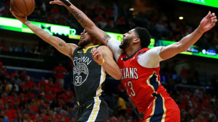 NEW ORLEANS, LA - MAY 04: Stephen Curry #30 of the Golden State Warriors is fouled by Anthony Davis #23 of the New Orleans Pelicans during the second half of Game Three of the Western Conference Semifinals of the 2018 NBA Playoffs at the Smoothie King Center on May 4, 2018 in New Orleans, Louisiana. NOTE TO USER: User expressly acknowledges and agrees that, by downloading and or using this photograph, User is consenting to the terms and conditions of the Getty Images License Agreement. (Photo by Sean Gardner/Getty Images)