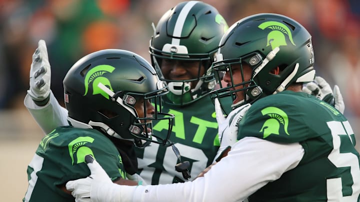 EAST LANSING, MICHIGAN – NOVEMBER 09: Tre Mosley #17 of the Michigan State Spartans celebrates his first half touchdown catch with teammates while playing the Illinois Fighting Illini at Spartan Stadium on November 09, 2019 in East Lansing, Michigan. (Photo by Gregory Shamus/Getty Images)