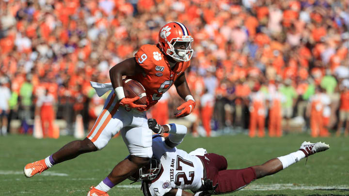 CLEMSON, SOUTH CAROLINA – SEPTEMBER 07: Roney Elam #27 of the Texas A&M Aggies tries to stop Travis Etienne #9 of the Clemson Tigers during their game at Memorial Stadium on September 07, 2019 in Clemson, South Carolina. (Photo by Streeter Lecka/Getty Images)