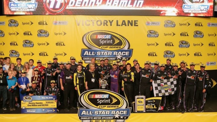 May 16, 2015; Concord, NC, USA; NASCAR Sprint Cup Series driver Denny Hamlin (11) celebrates after winning the Sprint All-Star Race at Charlotte Motor Speedway. Mandatory Credit: Randy Sartin-USA TODAY Sports