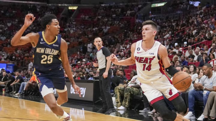 Tyler Herro #14 of the Miami Heat drives to the basket while being defended by Trey Murphy III #25 of the New Orleans Pelicans(Photo by Eric Espada/Getty Images)