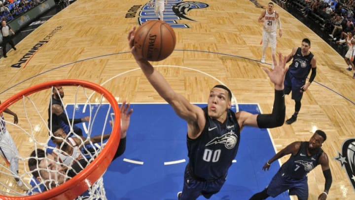 ORLANDO, FL - MARCH 24: Aaron Gordon #00 of the Orlando Magic grabs the rebound against the Phoenix Suns on March 24, 2018 at Amway Center in Orlando, Florida. NOTE TO USER: User expressly acknowledges and agrees that, by downloading and/or using this photograph, user is consenting to the terms and conditions of the Getty Images License Agreement. Mandatory Copyright Notice: Copyright 2018 NBAE (Photo by Fernando Medina/NBAE via Getty Images)