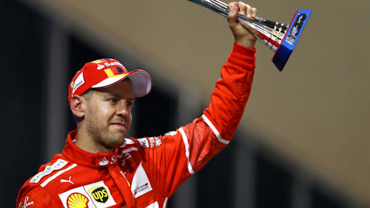 ABU DHABI, UNITED ARAB EMIRATES - NOVEMBER 26: Third place finisher Sebastian Vettel of Germany and Ferrari celebrates on the podium during the Abu Dhabi Formula One Grand Prix at Yas Marina Circuit on November 26, 2017 in Abu Dhabi, United Arab Emirates. (Photo by Dan Istitene/Getty Images)