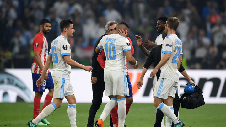 LYON, FRANCE – MAY 16: Dimitri Payet of Marseille is consoled by Antoine Griezmann of Atletico Madrid as he leaves the pitch after picking up an injury during the UEFA Europa League Final between Olympique de Marseille and Club Atletico de Madrid at Stade de Lyon on May 16, 2018 in Lyon, France. (Photo by Matthias Hangst/Getty Images)