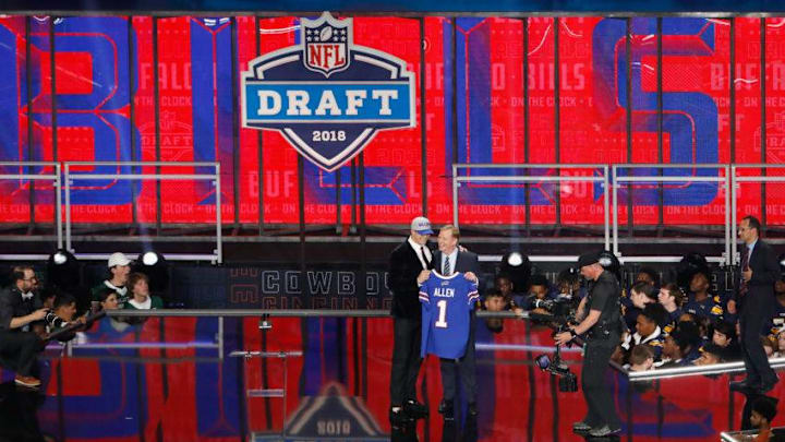 ARLINGTON, TX - APRIL 26: Josh Allen of Wyoming poses with NFL Commissioner Roger Goodell after being picked