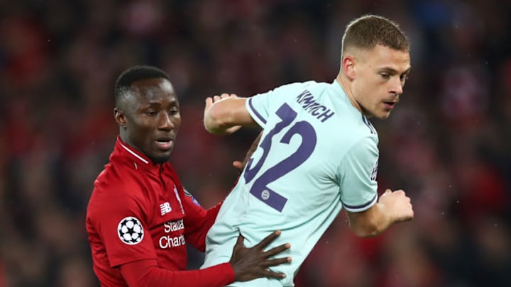 LIVERPOOL, ENGLAND - FEBRUARY 19: Joshua Kimmich of Bayern Munich battles with Naby Keita of Liverpool during the UEFA Champions League Round of 16 First Leg match between Liverpool and FC Bayern Muenchen at Anfield on February 19, 2019 in Liverpool, England. (Photo by Clive Brunskill/Getty Images)