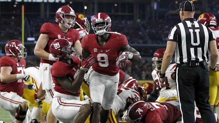 Sep 3, 2016; Arlington, TX, USA; Alabama Crimson Tide running back Bo Scarbrough (9) scores a touchdown during the second half against the USC Trojans at AT&T Stadium. Mandatory Credit: Tim Heitman-USA TODAY Sports