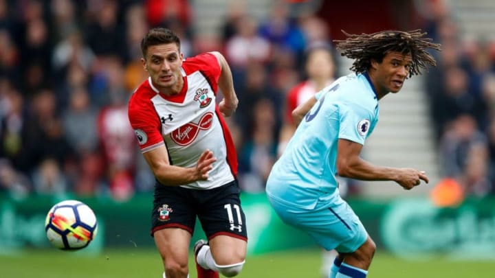 SOUTHAMPTON, ENGLAND – APRIL 28: Dusan Tadic of Southampton goes past Nathan Ake of Bournemouth during the Premier League match between Southampton and AFC Bournemouth at St Mary’s Stadium on April 28, 2018 in Southampton, England. (Photo by Julian Finney/Getty Images)