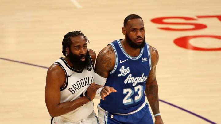 LOS ANGELES, CALIFORNIA – FEBRUARY 18: James Harden #13 of the Brooklyn Nets guards LeBron James #23 of the Los Angeles Lakers during the second quarter at Staples Center on February 18, 2021 in Los Angeles, California. NOTE TO USER: User expressly acknowledges and agrees that, by downloading and or using this photograph, User is consenting to the terms and conditions of the Getty Images License Agreement. (Photo by Katelyn Mulcahy/Getty Images)