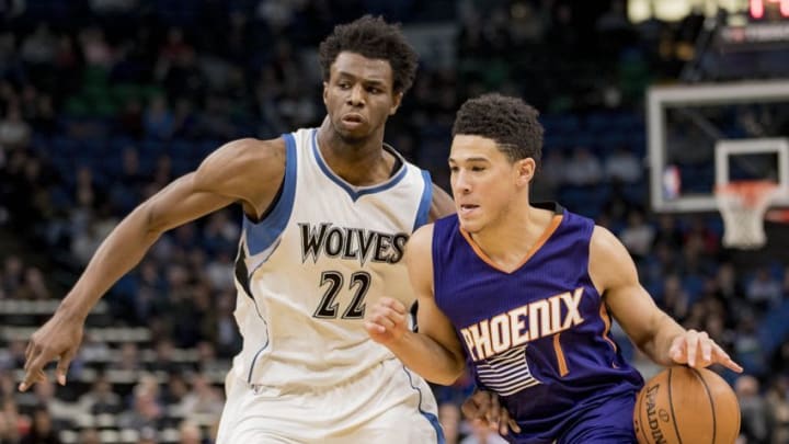 Dec 19, 2016; Minneapolis, MN, USA; Phoenix Suns guard Devin Booker (1) drives to the basket past Minnesota Timberwolves forward Andrew Wiggins (22) in the second half at Target Center. The Timberwolves won 115-108. Mandatory Credit: Jesse Johnson-USA TODAY Sports