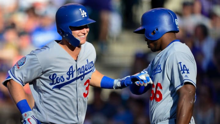 DENVER, CO - JUNE 02: Joc Pederson #31 of the Los Angeles Dodgers celebrates with Yasiel Puig #66 after hitting a fourth inning solo homerun against the Colorado Rockies at Coors Field on June 2, 2018 in Denver, Colorado. (Photo by Dustin Bradford/Getty Images)
