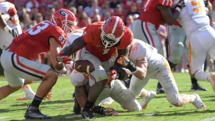 Oct 1, 2016; Athens, GA, USA; Georgia Bulldogs running back Sony Michel (1) fumbles after being hit by Tennessee Volunteers linebacker Colton Jumper (53) during the second quarter at Sanford Stadium. Mandatory Credit: Dale Zanine-USA TODAY Sports