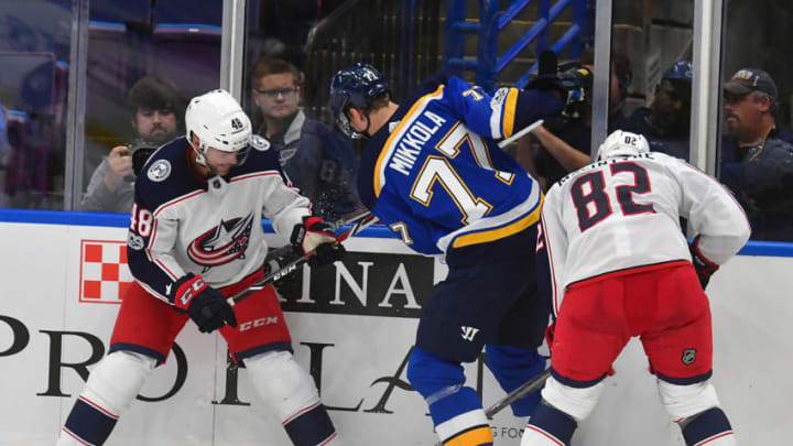 ST. LOUIS, MO - SEPTEMBER 20: Columbus Blue Jackets center Andre Benoit (48), St. Louis Blues defenseman Niko Mikkola (77), and Columbus Blue Jackets left wing Bobby MacIntyre (82) battle for the puck on the boards during a pre-season National Hockey League game between the Columbus Blue Jackets and the St. Louis Blues on September 20, 2017, at Scottrade Center in St. Louis, MO. (Photo by Keith Gillett/Icon Sportswire via Getty Images)