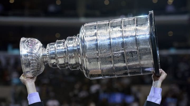 Jun 13, 2014; Los Angeles, CA, USA; The Stanley Cup is on the ice after the Los Angeles Kings defeated the New York Rangers in second overtime during game five of the 2014 Stanley Cup Final at Staples Center. Mandatory Credit: Gary Vasquez-USA TODAY Sports