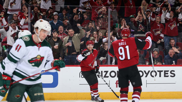 Phil Kessel #81 of the Arizona Coyotes celebrates with Taylor Hall #91 after scoring against the Minnesota Wild during the first period of the NHL game at Gila River Arena. (Photo by Christian Petersen/Getty Images)