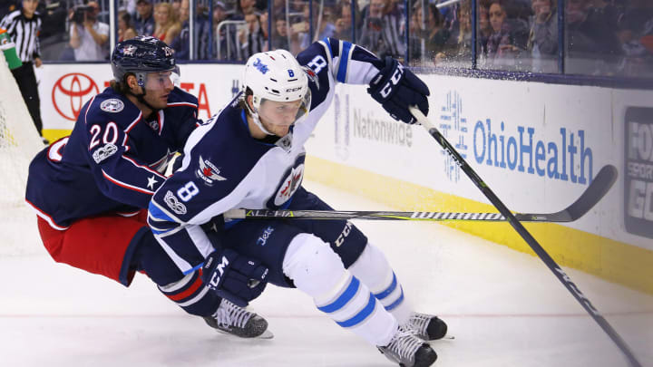 Apr 6, 2017; Columbus, OH, USA; Columbus Blue Jackets left wing Brandon Saad (20) skates against Winnipeg Jets defenseman Jacob Trouba (8) in the second period at Nationwide Arena. Mandatory Credit: Aaron Doster-USA TODAY Sports