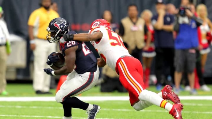 Sep 18, 2016; Houston, TX, USA; Houston Texans running back Lamar Miller (26) is tackled from behind by Kansas City Chiefs inside linebacker Derrick Johnson (56) during the first quarter at NRG Stadium. Mandatory Credit: Erik Williams-USA TODAY Sports