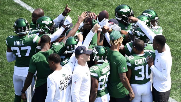 CHARLOTTE, NORTH CAROLINA - SEPTEMBER 12: The New York Jets huddle prior to the game against the Carolina Panthers at Bank of America Stadium on September 12, 2021 in Charlotte, North Carolina. (Photo by Mike Comer/Getty Images)