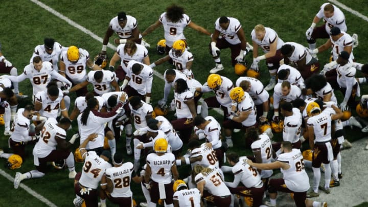 SEATTLE, WA - NOVEMBER 19: Members of the Arizona State Sun Devils kneel together prior to the game against the Washington Huskies on November 19, 2016 at Husky Stadium in Seattle, Washington. (Photo by Otto Greule Jr/Getty Images)