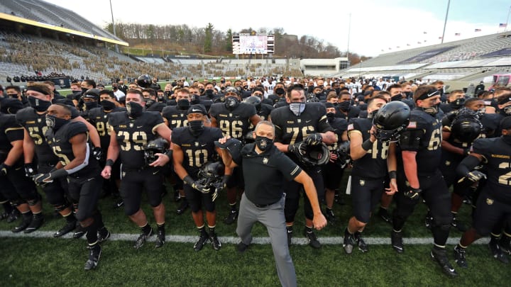 Nov 21, 2020; West Point, New York, USA; Army Black Knights head coach Jeff Monken (front) celebrates with his team after a win against the Georgia Southern Eagles at Michie Stadium. Mandatory Credit: Danny Wild-USA TODAY Sports