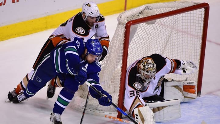 Dec 30, 2016; Vancouver, British Columbia, CAN; Vancouver Canucks forward Daniel Sedin (22) tries a wrap around attempt on goal against Anaheim Ducks goaltender John Gibson (36) and forward Ryan Kesler (17) during the third period at Rogers Arena. Mandatory Credit: Anne-Marie Sorvin-USA TODAY Sports