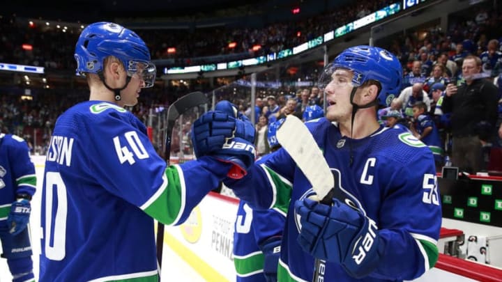 VANCOUVER, BC - OCTOBER 9: Bo Horvat #53 and Elias Pettersson #40 celebrate their win against the Los Angeles Kings during their NHL game at Rogers Arena October 9, 2019 in Vancouver, British Columbia, Canada. Vancouver won 8-2. (Photo by Jeff Vinnick/NHLI via Getty Images)