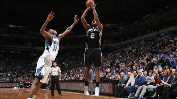 MINNEAPOLIS, MN – NOVEMBER 21: Kawhi Leonard #2 of the San Antonio Spurs shoots against Andrew Wiggins #22 of the Minnesota Timberwolves on November 21, 2014 at Target Center in Minneapolis, Minnesota. NOTE TO USER: User expressly acknowledges and agrees that, by downloading and or using this Photograph, user is consenting to the terms and conditions of the Getty Images License Agreement. Mandatory Copyright Notice: Copyright 2014 NBAE (Photo by David Sherman/NBAE via Getty Images)