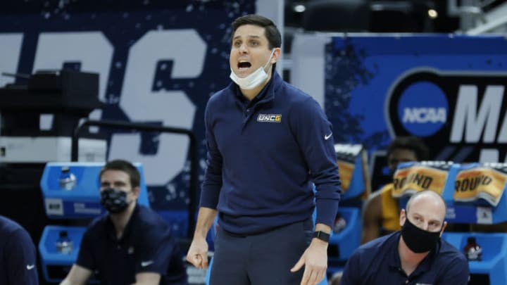 INDIANAPOLIS, INDIANA - MARCH 20: Head coach Wes Miller of the UNC-Greensboro Spartans reacts on the sideline during the first half against the Florida State Seminoles in the first round game of the 2021 NCAA Men's Basketball Tournament at Bankers Life Fieldhouse on March 20, 2021 in Indianapolis, Indiana. (Photo by Sarah Stier/Getty Images)