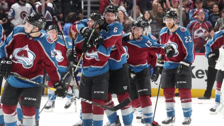 DENVER, CO - MARCH 29: Samuel Girard #49, Erik Johnson #6 and Alexander Kerfoot #13 of the Colorado Avalanche celebrate after a win against the Arizona Coyotes at the Pepsi Center on March 29, 2019 in Denver, Colorado. The Avalanche defeated the Coyotes 3-2 in a shoot out. (Photo by Michael Martin/NHLI via Getty Images)