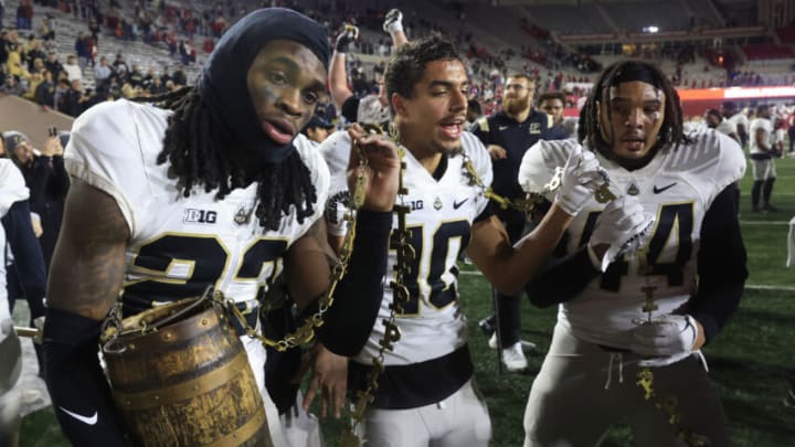BLOOMINGTON, INDIANA - NOVEMBER 26: Cory Trice #23, Cam Allen #10 and Kydran Jenkins #44 of the Purdue Boilermakers celebrate a win over the Indiana Hoosiers at Memorial Stadium on November 26, 2022 in Bloomington, Indiana. (Photo by Justin Casterline/Getty Images)
