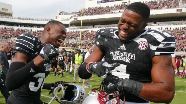 STARKVILLE, MS - NOVEMBER 5: Defensive back Chris Stamps #30 of the Mississippi State Bulldogs celebrates with linebacker Gerri Green #4 of the Mississippi State Bulldogs after the end of an NCAA college football game at Davis Wade Stadium on November 5, 2016 in Starkville, Mississippi. Mississippi State beat the Texas A&M Aggies 35-28. (Photo by Butch Dill/Getty Images)