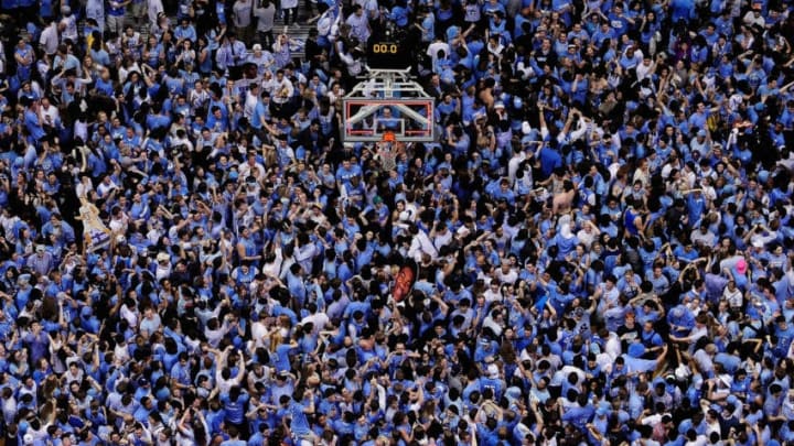 CHAPEL HILL, NC - FEBRUARY 20: North Carolina Tar Heels fans storm the court after a win over the Duke Blue Devils during their game at the Dean Smith Center on February 20, 2014 in Chapel Hill, North Carolina. North Carolina won 74-66. (Photo by Grant Halverson/Getty Images)