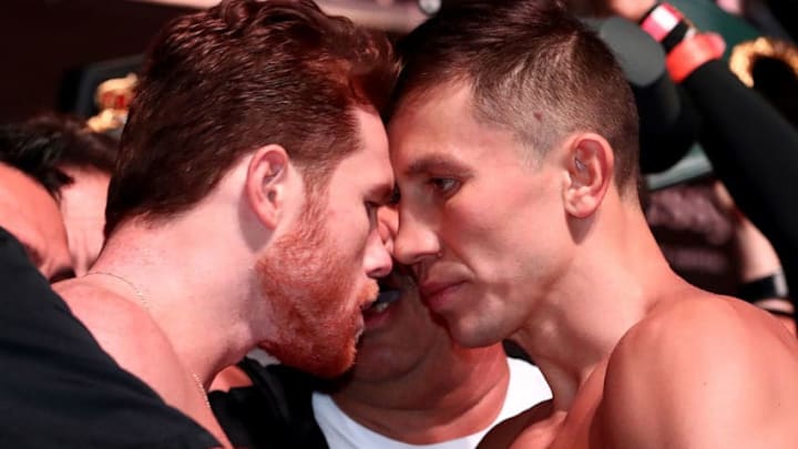 LAS VEGAS, NV - SEPTEMBER 14: Canelo Alvarez (L) and WBC/WBA middleweight champion Gennady Golovkin are held back after facing off during their official weigh-in at T-Mobile Arena on September 13, 2018 in Las Vegas,Nevada. Golovkin will defend his titles against Alvarez in a rematch on September 15 at T-Mobile Arena. (Photo by Al Bello/Getty Images)