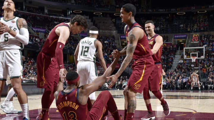 CLEVELAND, OH - MARCH 20: Tristan Thompson #13 of the Cleveland Cavaliers is helped up by his teammates during the game against the Milwaukee Bucks on March 20, 2019 at Quicken Loans Arena in Cleveland, Ohio. NOTE TO USER: User expressly acknowledges and agrees that, by downloading and/or using this photograph, user is consenting to the terms and conditions of the Getty Images License Agreement. Mandatory Copyright Notice: Copyright 2019 NBAE (Photo by David Liam Kyle/NBAE via Getty Images)