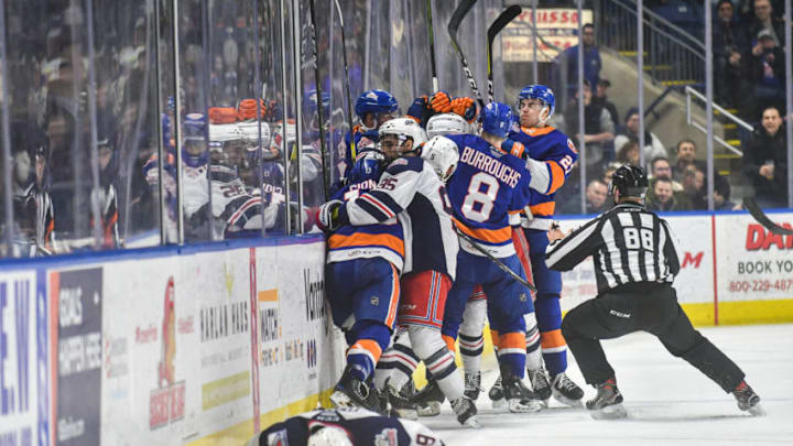 BRIDGEPORT, CT - JANUARY 12: Steven Fogarty #19 of the Hartford Wolf Pack lays face down on the ice after taking a hit as members of the Bridgeport Sound Tigers and Hartford Wolf Pack brawl during a game at Webster Bank Arena on January 12, 2019 in Bridgeport, Connecticut. (Photo by Gregory Vasil/Getty Images)